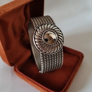Silver tone wide hinged cuff bangle, clamper bracelet with floral motif. Gift id